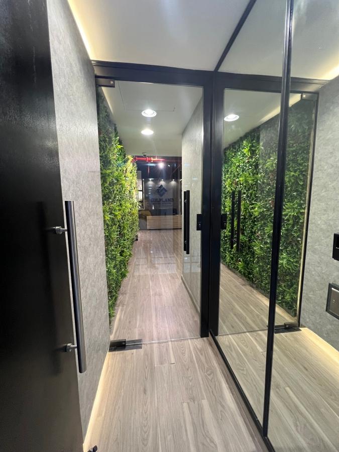 Inner corridor for entering into office in Dubai through gate made of glass