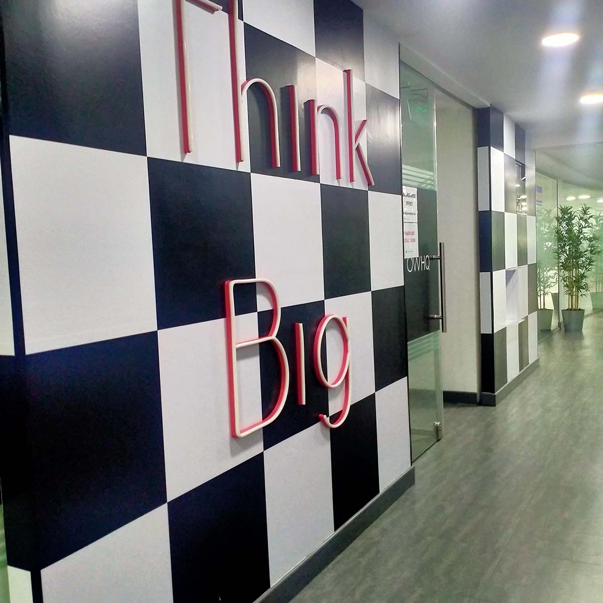 Dubai Office interior with wall signage on checks pattern design