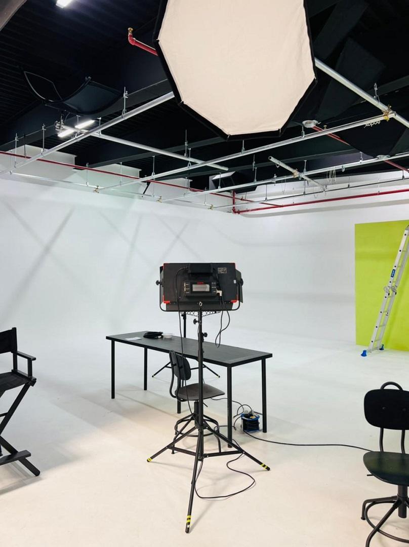 Media house news room with green screen effect and white walls